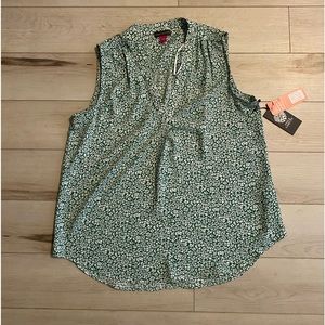 Green floral print sleeveless blouse. Size small and new with tags.